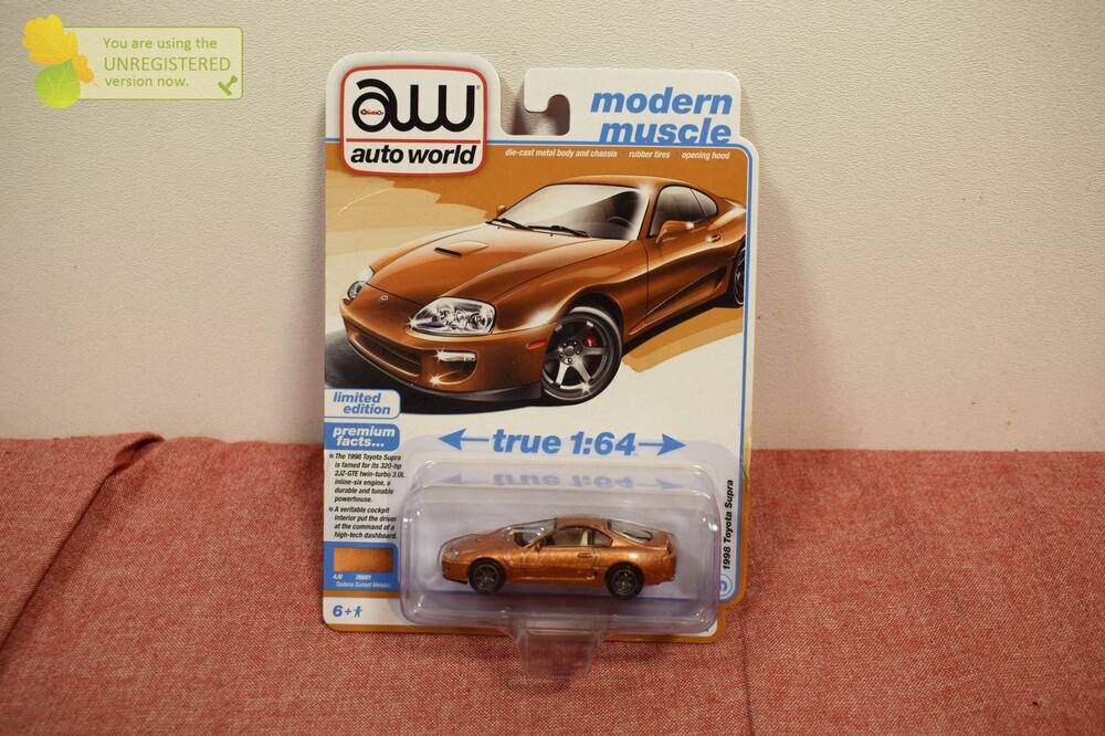 Auto World 1998 Toyota Supra Sunset Bronze Metallic Die-cast 1/64